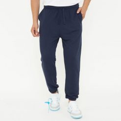 Spodnie sportowe unisex F BALLON niebieskie. Niebieskie spodnie treningowe długie Legea, bez wzorów, z gumy. W wyprzedaży za 92.00 zł.