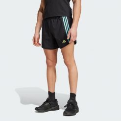 Szorty Own the Run 3-Stripes. Czarne szorty Adidas, bez wzorów, z materiału, sportowe. W wyprzedaży za 197.20 zł.
