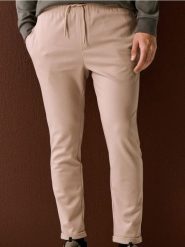 Spodnie dresowe jogger z domieszką wiskozy - beżowy. Brązowe joggery i bojówki Sinsay, l, bez wzorów, z dresówki. Za 49.99 zł.