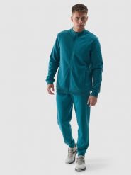 4F Spodnie dresowe joggery męskie - turkusowe M. Niebieskie joggery i bojówki 4F, na co dzień, l, bez wzorów, z bawełny, sportowe. W wyprzedaży za 79.99 zł.