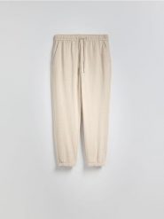 Spodnie jogger z lnem - beżowy. Brązowe joggery i bojówki Reserved, l, bez wzorów, z wiskozy. Za 149.99 zł.