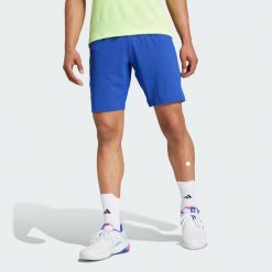 Szorty Tennis Ergo. Niebieskie krótkie spodenki sportowe Adidas, s, bez wzorów, z elastanu. Za 239.00 zł.