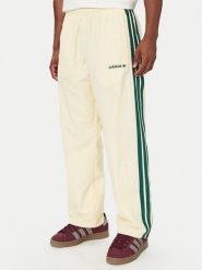 Adidas Spodnie dresowe Cutline Track Tracksuit Bottoms KW8021 Kremowy Regular Fit. Białe komplety dresowe Adidas, m, bez wzorów, z dresówki, bez ramiączek. Za 329.99 zł.