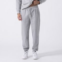 Ikoniczne Spodnie Z Mankiecikiem Siwy Melanz Bawelna, Poliester. Szare spodnie materiałowe EVERLAST, m, bez wzorów, z bawełny. Za 199.40 zł.