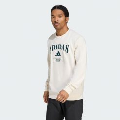 Bluza adidas Heritage Graphic Crew. Białe bluzy Adidas, s, bez wzorów, bez kaptura. W wyprzedaży za 203.67 zł.