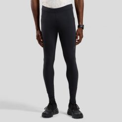 Legginsy tech. Tights ESSENTIAL. Czarne legginsy długie sportowe ODLO, l, bez wzorów, z elastanu, do biegania. Za 319.99 zł.