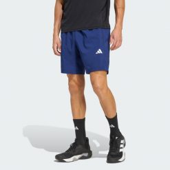 Tkane Szorty Do Ćwiczeń Essentials Base. Niebieskie szorty Adidas, bez wzorów, sportowe. Za 119.00 zł.