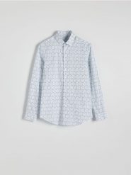 Koszula slim fit w drobne kwiaty - jasnoniebieski. Niebieskie koszule Reserved, l, bez wzorów, z bawełny, bez kołnierzyka, bez ramiączek. Za 139.99 zł.