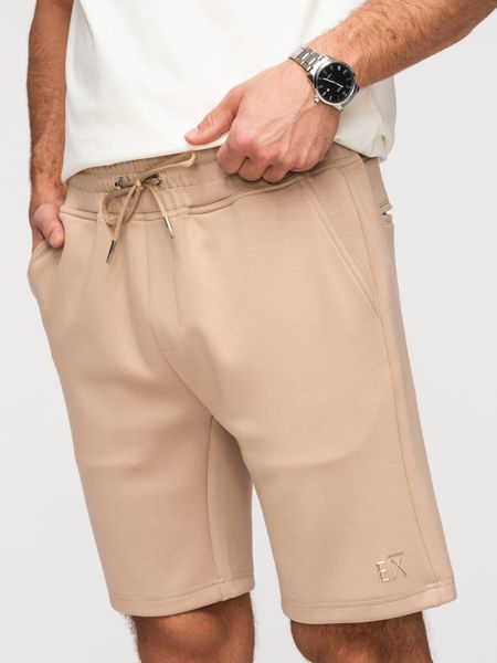 Męskie szorty z gładkiej dzianiny REGULAR FIT - beżowe V3 - Rozmiar: M. Brązowe szorty Ombre Clothing, m, bez wzorów, z dzianiny, wizytowe. W wyprzedaży za 118.99 zł.