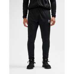 SPODNIE hmlESSENTIAL TRAINING PANTS. Czarne spodnie treningowe długie Hummel, m, bez wzorów, z dresówki. Za 100.00 zł.