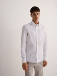 Koszula slim z bawełny egipskiej - biały. Białe koszule Reserved, l, bez wzorów, z bawełny, bez kołnierzyka, bez ramiączek. W wyprzedaży za 59.99 zł.