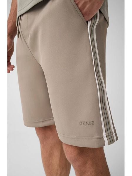 Guess Spodnie materiałowe 183578 Zielony Bermuda Fit. Zielone spodnie materiałowe Guess, m, z aplikacjami, z materiału. Za 344.99 zł.