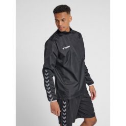 Kurtka przeciwdeszczowa Hummel Authentic Wind Breaker czarna. Białe kurtki Hummel, m, bez wzorów, bez kaptura. Za 139.00 zł.