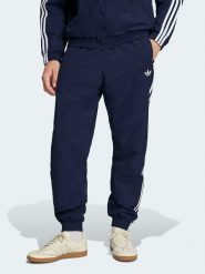 Adidas Spodnie dresowe w kolorze granatowym rozmiar: XL. Niebieskie spodnie treningowe długie Adidas, xl, bez wzorów, z dresówki. Za 154.95 zł.