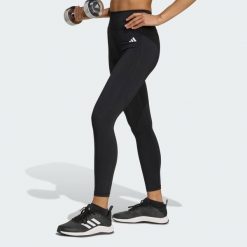 Legginsy Optimé Essentials No Front Rise Seam 7/8. Czarne legginsy długie sportowe Adidas, l, bez wzorów, z elastanu, z podwyższonym stanem, na fitness i siłownię, climacool (adidas). Za 241.70 zł.