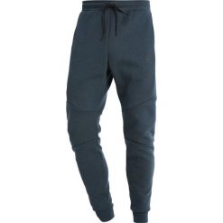 Nike Sportswear TECH JOGGER Spodnie treningowe mottled dark green. Spodnie treningowe długie marki Nike Sportswear. Za 339.00 zł.