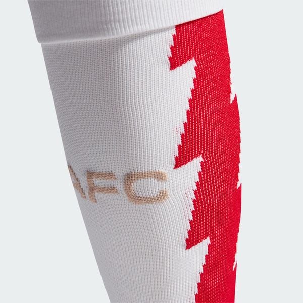 Getry Arsenal 23/24 Home. Białe legginsy długie sportowe Adidas, bez wzorów, z bawełny, do piłki nożnej. Za 54.50 zł.