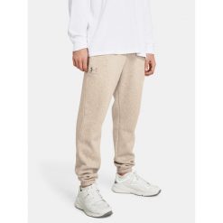 Spodnie treningowe męskie Under Armour Essential Fleece Joggers. Brązowe buty treningowe Under Armour, bez wzorów, na fitness i siłownię. W wyprzedaży za 259.50 zł.