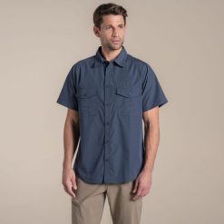 Koszula Craghoppers Kiwi II. Niebieskie koszule Craghoppers, m, bez wzorów, bez kołnierzyka, bez ramiączek. W wyprzedaży za 208.60 zł.