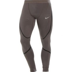 Nike Performance TECH Legginsy ridgerock/black/reflective silver. Spodnie treningowe długie marki Nike Performance, z elastanu. Za 259.00 zł.
