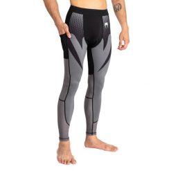 Legginsy męskie Venum Attack Spats. Czarne legginsy długie sportowe VENUM, m, bez wzorów. Za 169.99 zł.