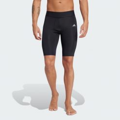 Legginsy TECHFIT Short. Czarne legginsy długie sportowe Adidas, bez wzorów, z elastanu, techfit (adidas). Za 131.00 zł.