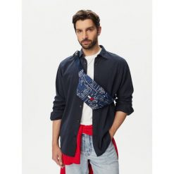 Nerka Tommy Jeans. Niebieskie saszetki i nerki Tommy Jeans, bez wzorów, z jeansu. Za 209.99 zł.