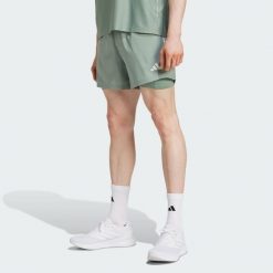 Szorty Own the Run CLIMACOOL 2-in-1. Zielone buty do biegania Adidas, bez wzorów, bez zapięcia, do biegania, climacool (adidas). W wyprzedaży za 181.10 zł.