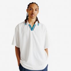 Koszulka polo oversize męska Heritage. Białe koszulki polo Decathlon, bez wzorów, z materiału, bez ramiączek, na golfa. Za 89.99 zł.