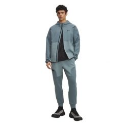 Męskie Slim Joggers Fleece Unstoppable (Jasper). Czarne joggery i bojówki Under Armour, m, bez wzorów, z bawełny, klasyczne, z standardowym stanem. Za 445.40 zł.