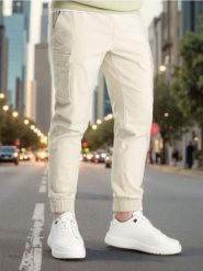 Spodnie jogger - beżowy. Brązowe joggery i bojówki Sinsay, m, bez wzorów, z bawełny. Za 59.99 zł.