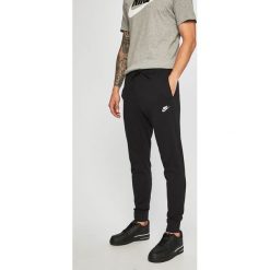 Nike Sportswear - Spodnie. Czarne spodnie materiałowe Nike Sportswear, na co dzień, l, bez wzorów, z bawełny, casualowe. Za 139.90 zł.