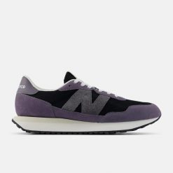 Buty klasyczne męskie New Balance 237 Lifestyle (M23718J). Czarne sztyblety New Balance, bez wzorów, z materiału, bez obcasa, bez zapięcia. Za 269.00 zł.