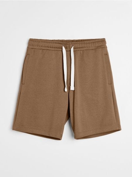 Szorty dresowe - brązowy. Brązowe krótkie spodenki sportowe Sinsay, l, bez wzorów, z dresówki. Za 29.99 zł.