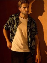 Wiskozowa koszula z motywem roślinnym - czarny. Czarne koszule Sinsay, l, bez wzorów, z wiskozy, bez kołnierzyka, bez ramiączek. Za 39.99 zł.