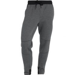 Reebok KNIT JOGGER Spodnie treningowe dark grey heather. Joggery i bojówki marki Reebok. W wyprzedaży za 251.10 zł.
