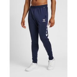 Spodnie joggingowe Hummel hmlCORE. Niebieskie szorty Hummel, m, bez wzorów, z materiału, sportowe. Za 175.50 zł.
