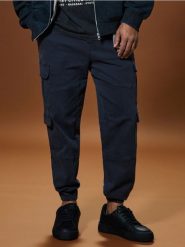 Spodnie jogger cargo - green spruce. Zielone joggery i bojówki Sinsay, m, bez wzorów. Za 79.99 zł.
