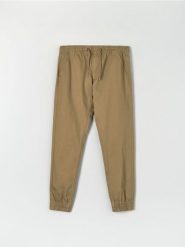 Spodnie jogger - beżowy. Brązowe joggery i bojówki Sinsay, m, bez wzorów, z bawełny. Za 49.99 zł.