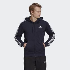 Bluza dresowa męska adidas ESSENTIAL 3 STRIPES. Białe bluzy Adidas, m, bez wzorów, z dresówki, z kapturem. Za 213.00 zł.