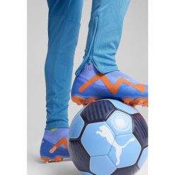 Męskie spodnie treningowe Manchester City PUMA Magic Blue Yellow Glow. Niebieskie spodnie treningowe długie Puma, l, bez wzorów. W wyprzedaży za 251.20 zł.