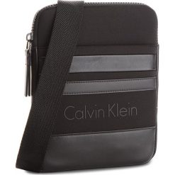 Saszetka CALVIN KLEIN BLACK LABEL - Neo Graphic Flat Cro K50K503509 001. Saszetki i nerki marki Calvin Klein Black Label. W wyprzedaży za 249.00 zł.