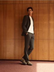 Garniturowe spodnie slim fit - ciemnozielony. Zielone garnitury Reserved, bez wzorów, z tkaniny. W wyprzedaży za 99.99 zł.