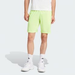 Szorty Tennis Ergo. Żółte krótkie spodenki sportowe Adidas, m, bez wzorów, z elastanu. Za 241.70 zł.