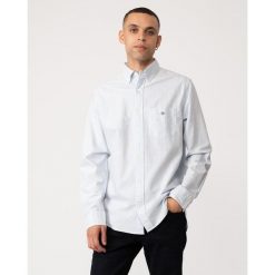 Koszula w paski Gant Classic Oxford. Niebieskie koszule GANT, l, z aplikacjami, z bawełny, bez kołnierzyka, bez ramiączek. Za 493.50 zł.