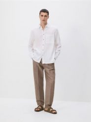 Muślinowa koszula regular fit - biały. Białe koszule Reserved, l, bez wzorów, z bawełny, bez kołnierzyka, bez ramiączek. Za 119.99 zł.
