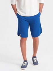 Szorty męskie dresowe z zaokrągloną nogawką - niebieskie V1 OM-SRSK-0105 - XL. Niebieskie krótkie spodenki sportowe Ombre Clothing, l, bez wzorów, z bawełny. W wyprzedaży za 39.99 zł.