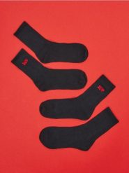 Skarpetki 2 pack - czarny. Czarne skarpety Sinsay, bez wzorów, z materiału. Za 8.99 zł.