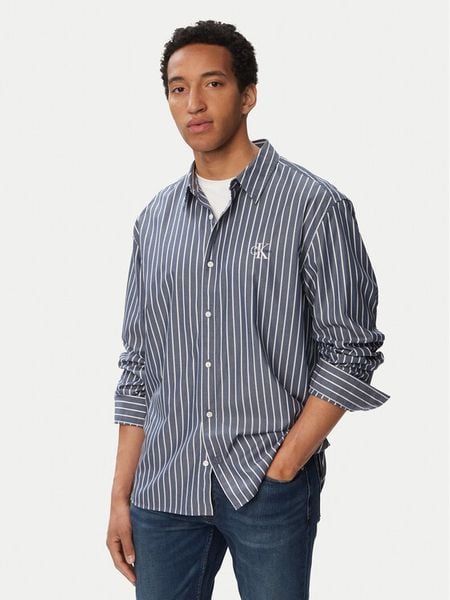 Calvin Klein Jeans Koszula Ls Yd LV04RF106G Niebieski Regular Fit. Niebieskie koszule Calvin Klein Jeans, m, bez wzorów, z bawełny, bez kołnierzyka, bez ramiączek. Za 409.99 zł.
