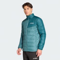 Kurtka Terrex Multi Light Down CLIMAWARM z lekkim ociepleniem z puchu. Niebieskie kurtki Adidas, bez wzorów, z puchu, bez kaptura. Za 599.00 zł.